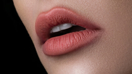 Beautiful female lips with beige make-up close-up