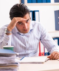 Young employee sitting at the office