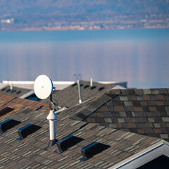 Square Television satellite dish mounted on a roof