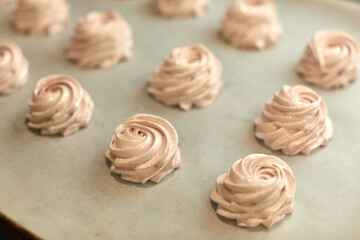 sweet meringue are ready for baking in the oven