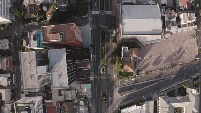 Drone shot of Avenue twelve of October in the city of Quito, Ecuador during quarantine. Overlooking buildings and houses, empty streets with no cars and trees.