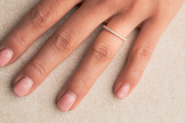 close up of a hand holding a ring