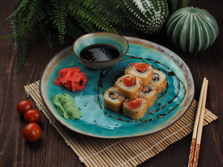 Fresh and tasty sushi on the wooden table
