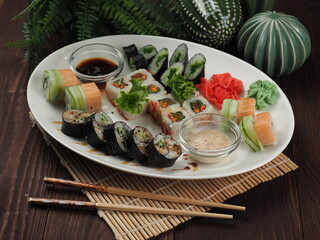 Fresh and tasty sushi on the wooden table