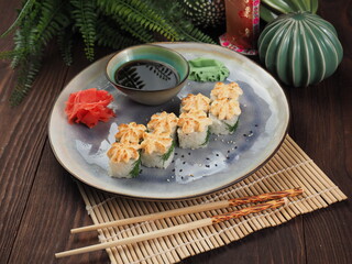 Fresh and tasty sushi on the wooden table