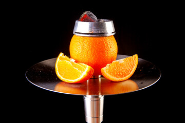 hot orange hookah with calaud filled with hot coals © Yehor Serdiuk