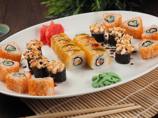 Fresh and tasty sushi on the wooden table