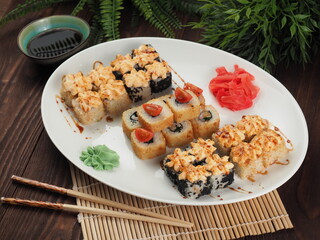Fresh and tasty sushi on the wooden table