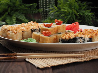 Fresh and tasty sushi on the wooden table