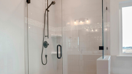 Panorama Bathroom shower stall with half glass enclosure adjacent to built in bathtub