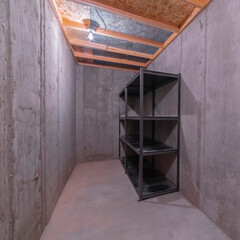 Square crop Storage shelves in a bare concrete room