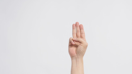 A hand sign of 3 fingers point upward meaning three, third or use in protest.It put on white background.