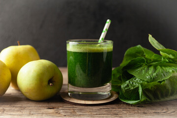 Healthy green smoothie on vintage wooden table. Fresh detox nutrient.
