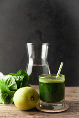 Healthy green smoothie on vintage wooden table. Fresh detox nutrient.
