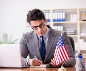 Businessman with American flag in office