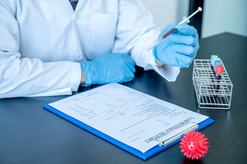 Professional doctors perform find virus tests from samples of blood tests to diagnose coronary...
