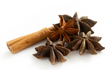 Dried Herbs and Spices: Cinnamon sticks and star anise isolated on white background.
