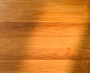 Top view of wooden table with shadow overlay