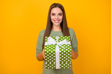 Portrait of content lovely pretty sweet cute girl hold big dotted gift she get on 14-february 8-march anniversary celebration wear good look sweater isolated over bright color background