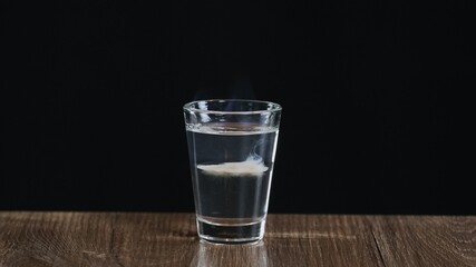 The bartender fire to an alcoholic cocktail with sambuca and Irish cream