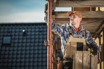 Scaffolding Assembly by Caucasian Construction Worker