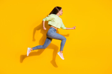 Fototapeta na wymiar Full size profile side photo of cheerful girl jump run fast speed hurry season discounts wear good look clothes gumshoes isolated over shine color background