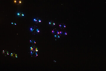 Soap bubbles isolated on a black background. Copy space.