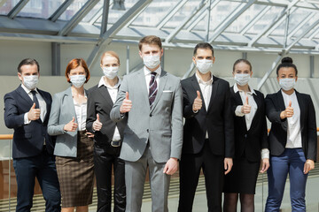 Successful business people wearing masks