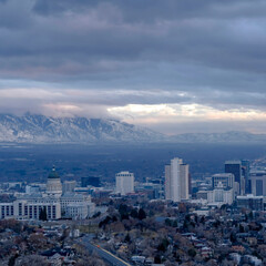 Square crop Downtown Salt Lake City with amazing view of steep snowy mountain in winter