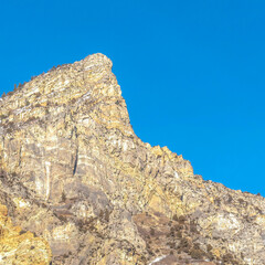 Square frame Peak of a rocky mountain with clear blue sky background in Provo Canyon Utah