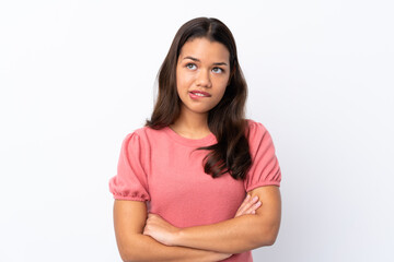 Young Colombian girl over isolated white background with confuse face expression