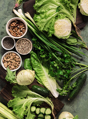 Healthy vegan food with vegetables nuts seeds and cereals top view Cooking green eating concept