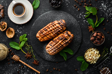 Sweet eclair cake with chocolate. Baking. Top view, free copy space.