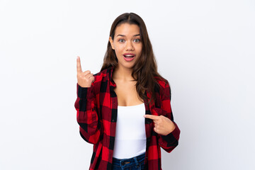 Young Colombian girl over isolated white background with surprise facial expression