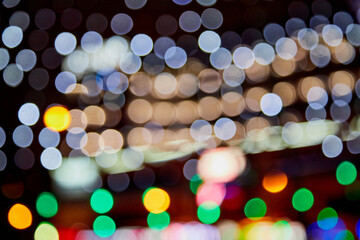 Abstract texture with light colored bokeh and black background