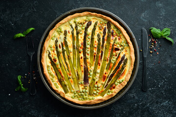 Puff pastry tart with asparagus and spices. Healthy food. Top view. Free space for your text.