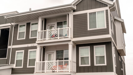 Panorama Small modern apartment block with balconies day light