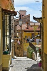 Naklejka premium A narrow street between the houses of the medieval town of Eboli in the province of Salerno, Italy.
