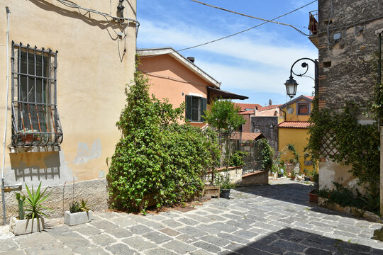 A narrow street between the houses of the medieval town of Eboli in the province of Salerno, Italy.