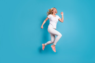Full size profile side photo of enthusiastic crazy funky funny woman hear incredible discounts jump...