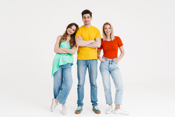 Fototapeta premium Image of cheerful caucasian man and women posing and smiling at camera