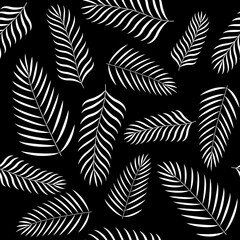 exotic tropical Palm leaves seamless pattern on black background. Stock vector illustration