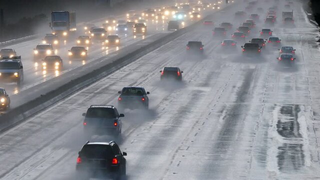 Time lapse of commuters in heavy rain on the 10 lane 118 Freeway in the Chatsworth area of Los Angeles, California