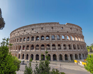 Naklejka na ściany i meble Rome Italy, impressive view of the Colosseum ancient amphitheater under clear blue sky