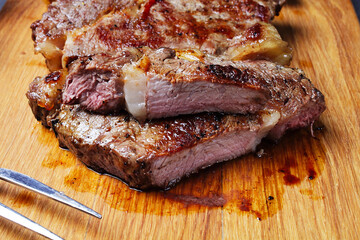 grilled beef steak on a cutting board, close-up