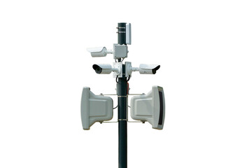 many surveillance cameras and a megaphone hanging on a pole isolate