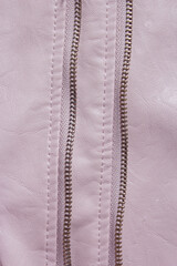 Pink Leather Background. Pink leather background with zipper from the lock. Structured background design leather.