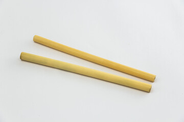 Two Biodegradable Bamboo Straws on a white background. Environmentally Friendly Alternative to Plastic.