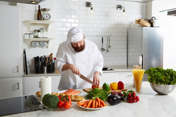 Professional cook cut vegetables in the kitchen,
