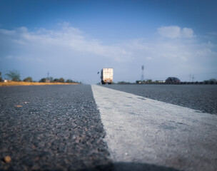 empty road with blue and white clouds